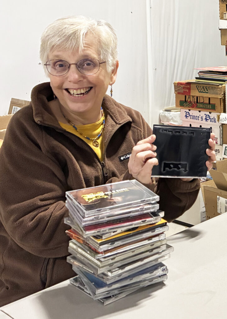 Claire Milner sorting books at the workshop