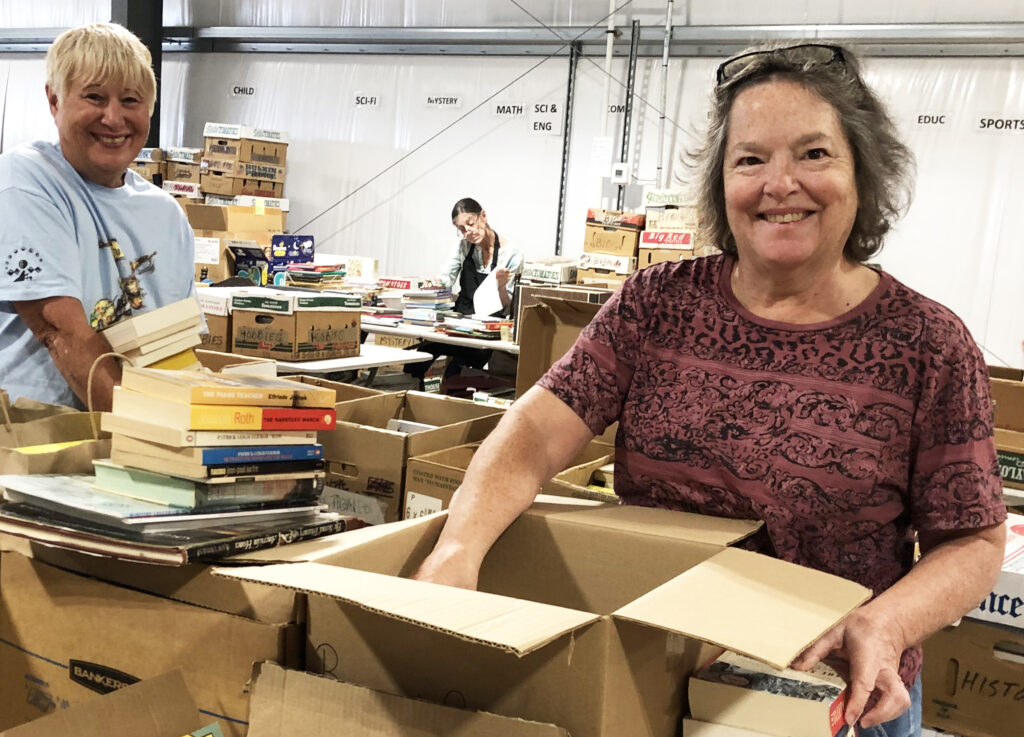 Volunteers sorting books at the Used Book Workshop